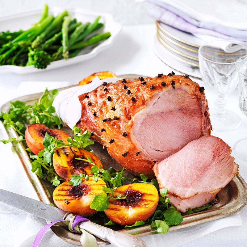 Orange glazed ham with grilled peaches