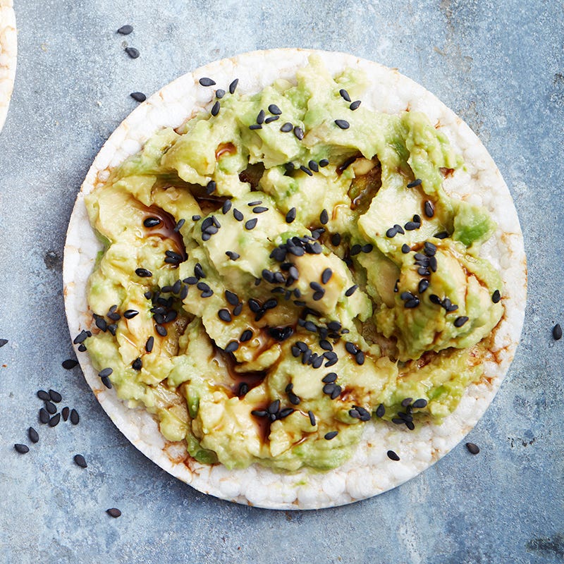 Avocado tamari and black sesame seed rice cake